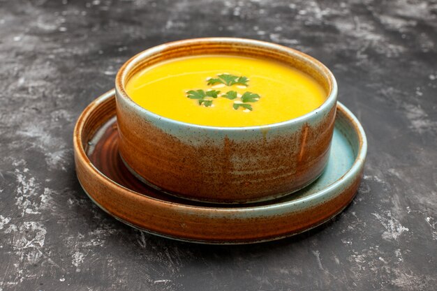 Front view tasty pumpkin soup inside plate on dark table fruit soup meal dish