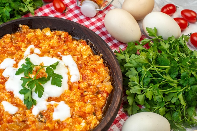 Front view tasty tomato omelette with greens and fresh vegetables on white background morning scrambled eggs bread milk lunch