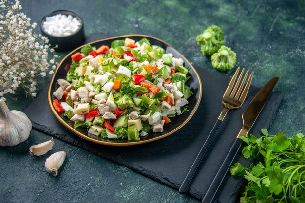 front view tasty vegetable salad inside plate with fork on dark background