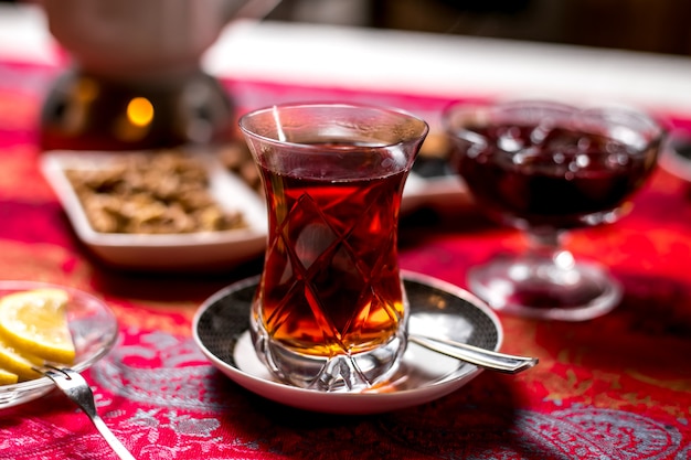 Front view tea glass of armudu with lemon slices