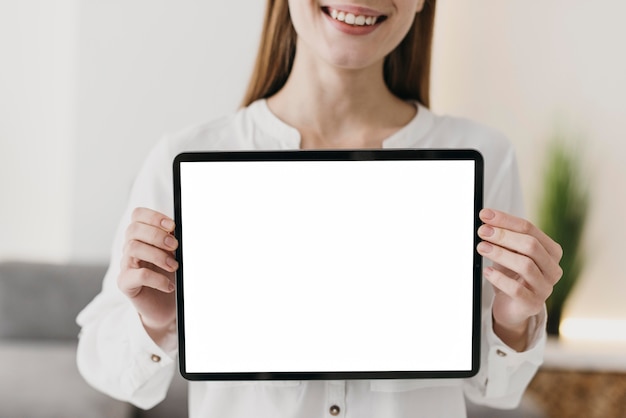 Front view teacher holding copy space digital tablet