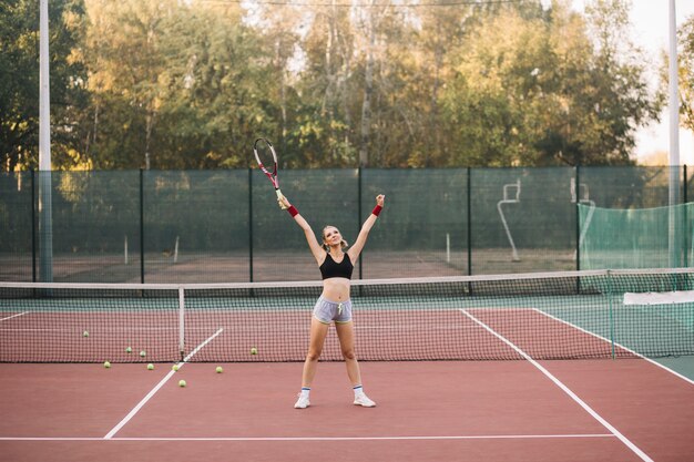 Front view tennis female player celebrating win