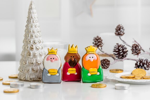 Front view of three kings with coins for epiphany day