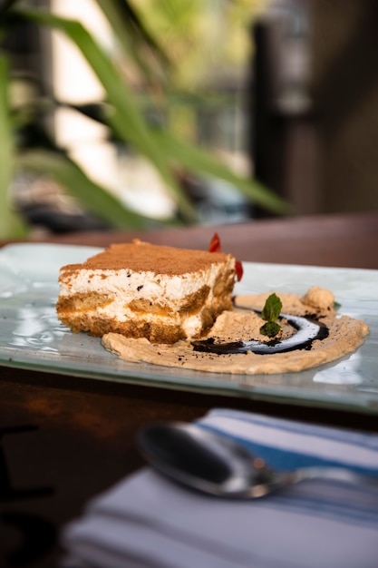 Free photo front view tiramisu plating