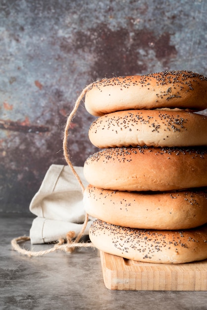 Free photo front view tower of bagels with poppy seeds