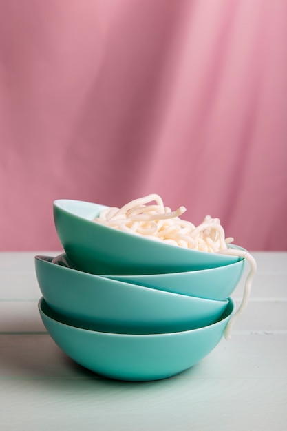 Front view tower of bowls with ramen