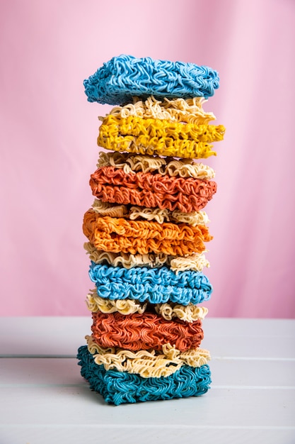 Free photo front view tower of colorful ramen noodles