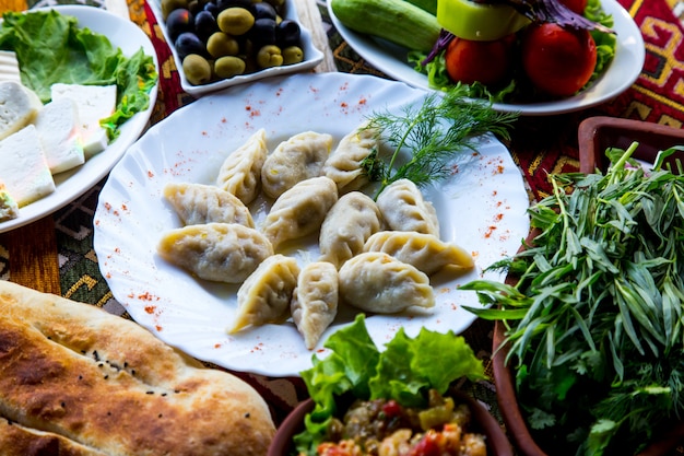 Front view traditional azerbaijani dish gyurza with herbs and vegetables