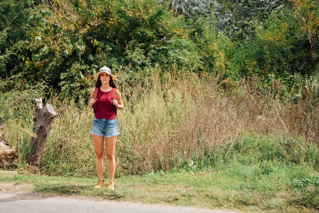 Front view of traveler waiting by the road