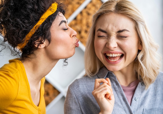 Front view of two happy women laughing