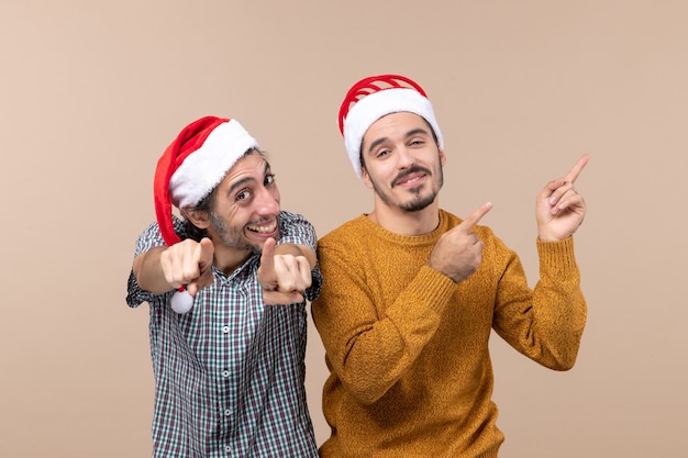 Front view two men both point finger showing something on isolated background