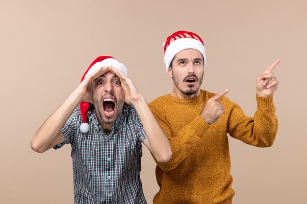 Front view two men one putting his hands to his forehead the other showing something on isolated background