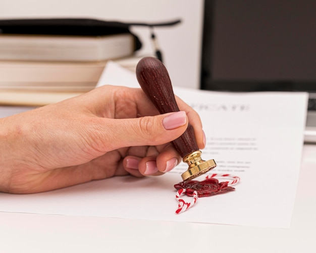 Free photo front view using wax seal for graduation diploma certificate