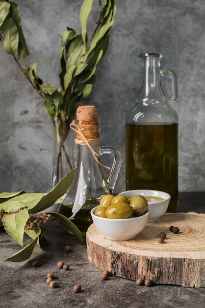 Download Premium Photo High Angle Olive Oil Bottle And Saucer With Yellow Olives And Copy Space PSD Mockup Templates