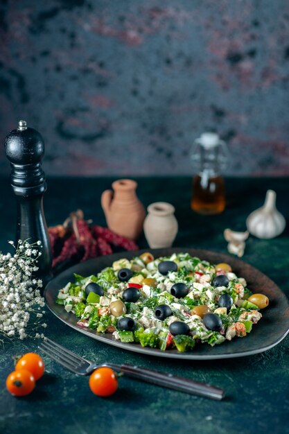 Front view vegetable salad with mayyonaise and olives on dark blue surface drink meal holiday health dish photo color kitchen bread