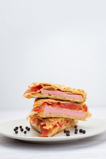 Front view vegetable sliced pastry inside plate on white