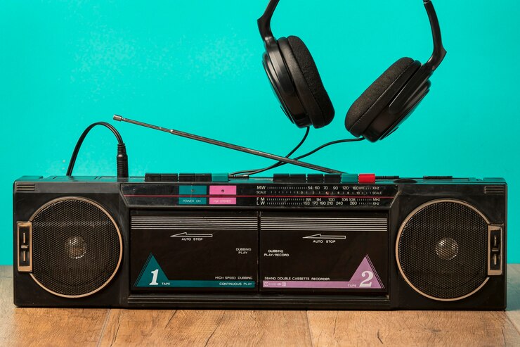 Free Photo front view vintage cassette and headphones
