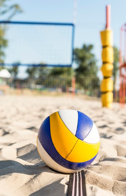 Front view of volleyball on the beach sand