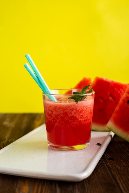 Front view watermelon natural juice in glass with straws