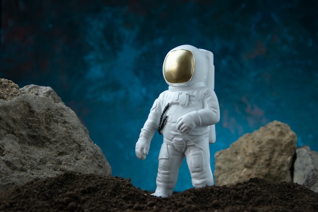 Front view of white astronaut on moon on blue  fantasy sci fi