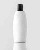 Free photo a front view white bottled shampoo with black cap isolated on the white wall