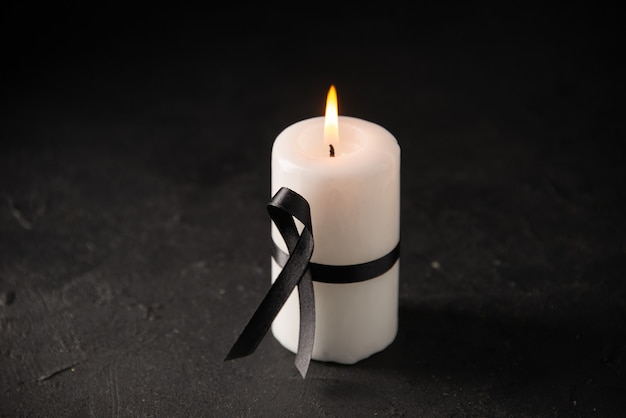 front view of white candle with black