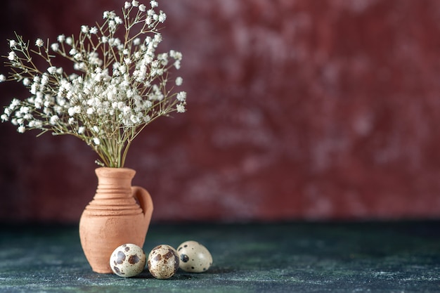 Front view white flowers with quail eggs on dark background beauty tree color photo nature food bird