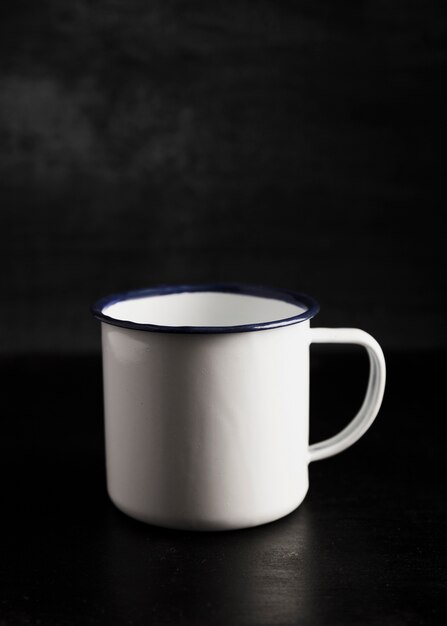 Front view white mug on black background