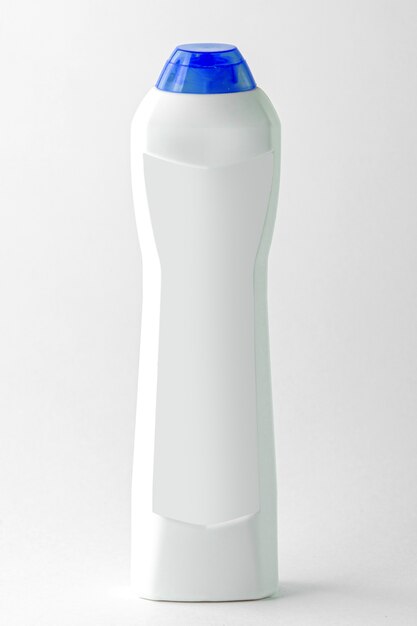 A front view white shampoo bottle with blue cap tube isolated on the white