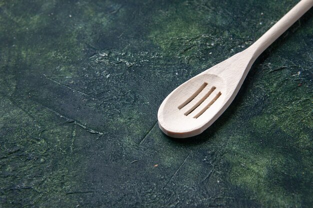 Front view white spoon on the dark background cutlery food kitchen wood plastic darkness fork knife color