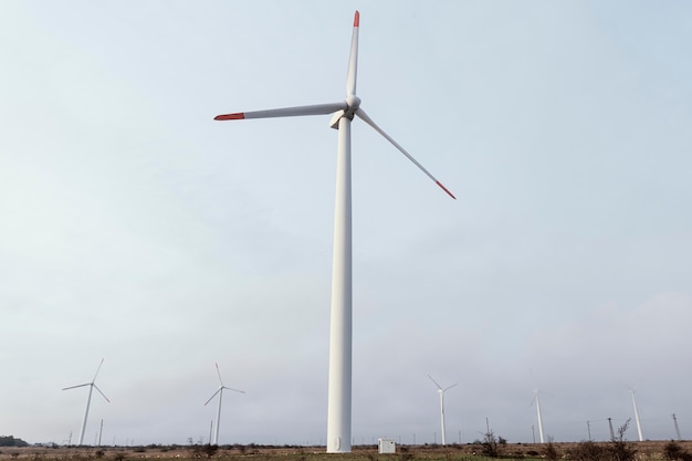 Front view of wind turbine in the field generating energy