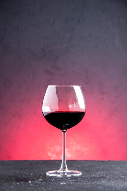 Front view wine glass on red isolated background