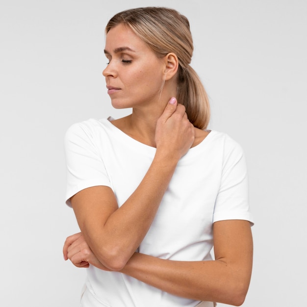 Front view of woman bothered by neck pain