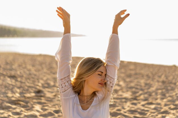 Front view of woman carefree woman at beach