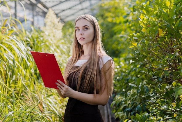 Front view woman checking clipboard list