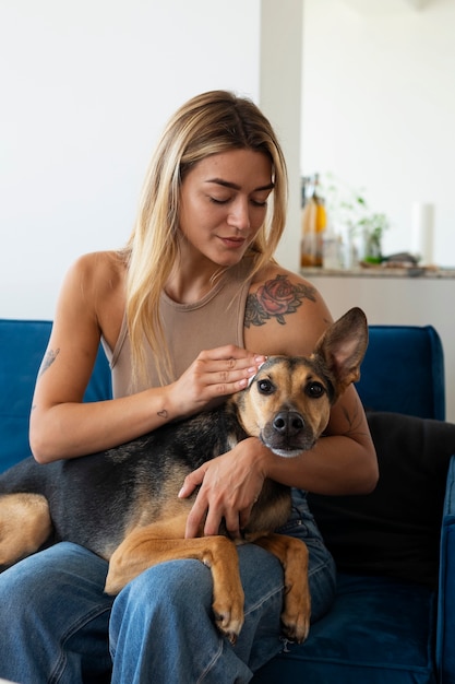 Front view woman cleaning dog