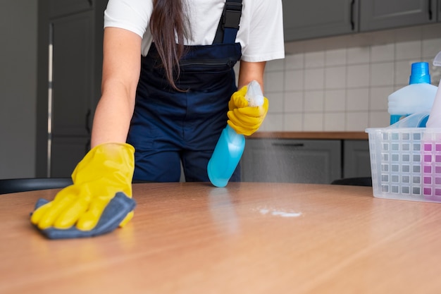 Free photo front view woman cleaning home