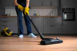 Free photo front view woman cleaning home