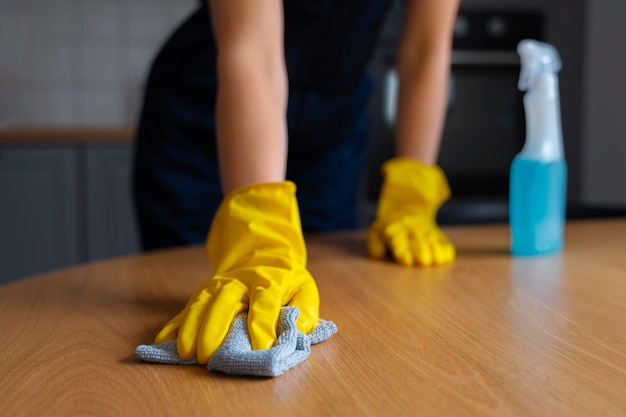 Front view woman cleaning home