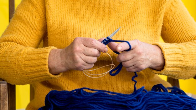 Front view of woman crocheting