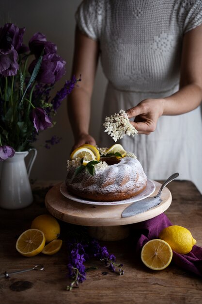 Front view woman decorating dessert