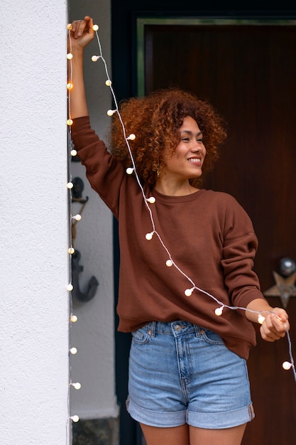 Front view woman decorating home