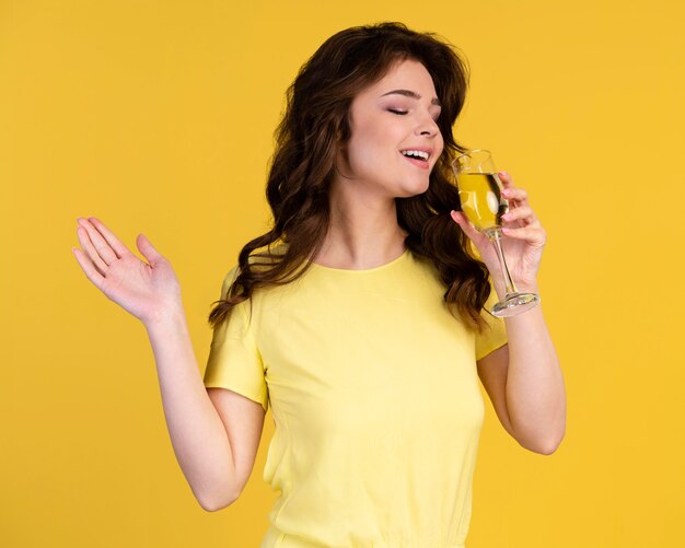 Front view of woman drinking champagne