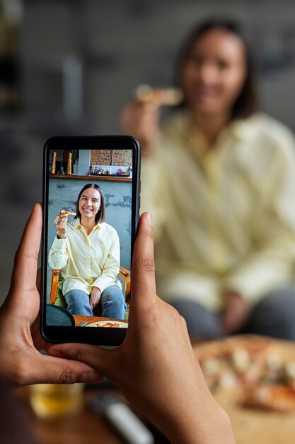 front view woman eating delicious pizza