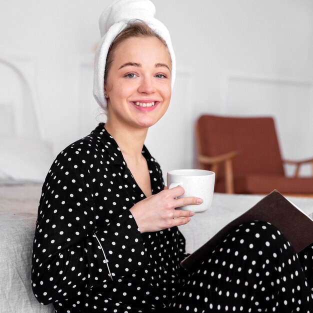 Front view of woman enjoying coffee