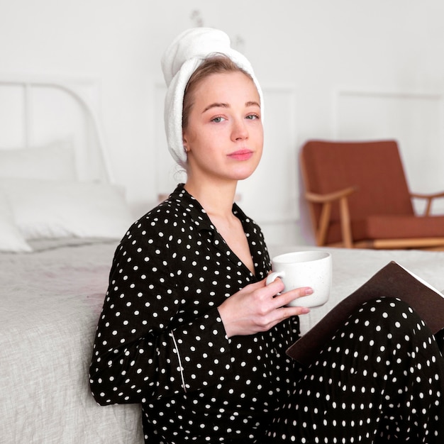 Front view of woman enjoying coffee