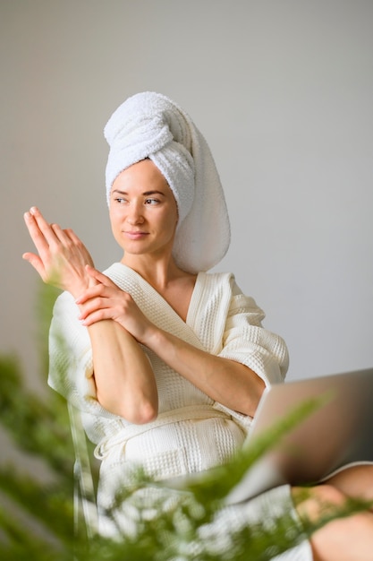 Front view of woman enjoying a spa day at home