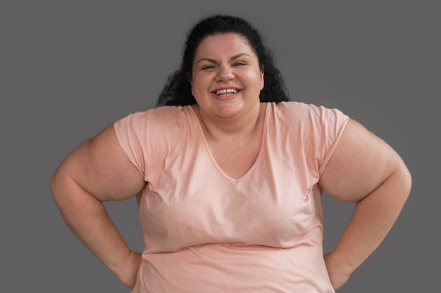 Free photo front view woman exercising at gym