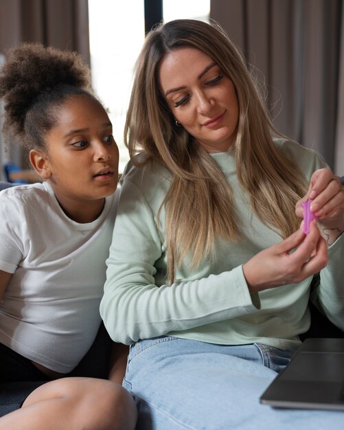 Front view woman explaining menstrual cup