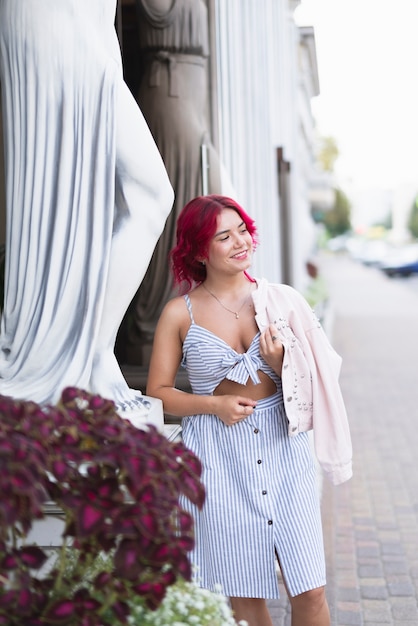 Free photo front view of woman and flowers